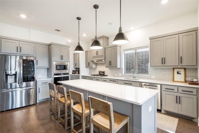 kitchen with stainless steel appliances and gray cabinetry