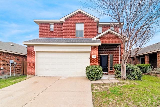 traditional home with an attached garage, brick siding, and driveway