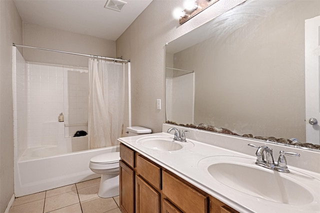 full bath featuring tile patterned flooring, visible vents, a sink, and toilet