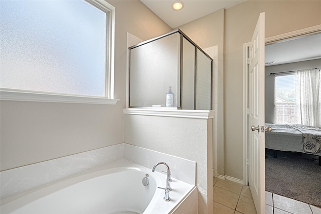 full bath featuring a shower stall, connected bathroom, a bath, and tile patterned floors