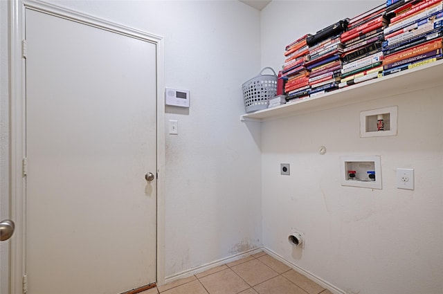 laundry area featuring laundry area, light tile patterned floors, hookup for a gas dryer, hookup for a washing machine, and electric dryer hookup