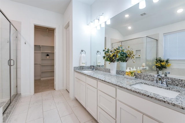 bathroom featuring marble finish floor, visible vents, a sink, and a stall shower