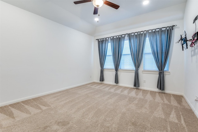 unfurnished room featuring carpet, baseboards, and a ceiling fan