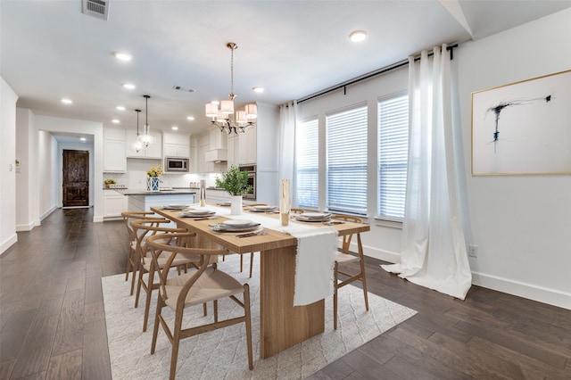 dining area featuring recessed lighting, visible vents, baseboards, dark wood finished floors, and an inviting chandelier