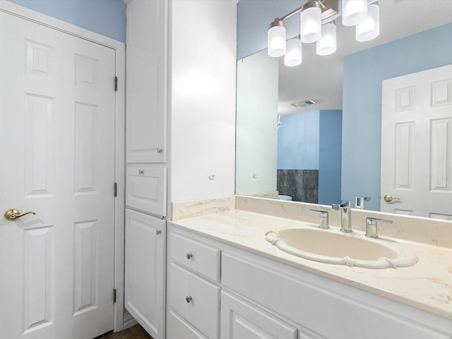 bathroom with visible vents and vanity