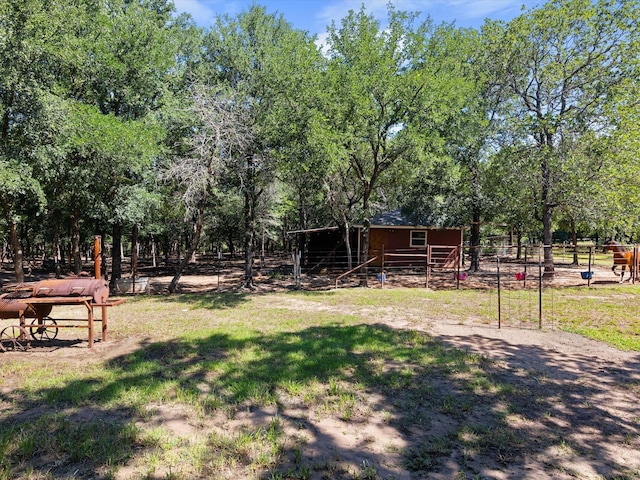 view of yard with an outbuilding and an exterior structure