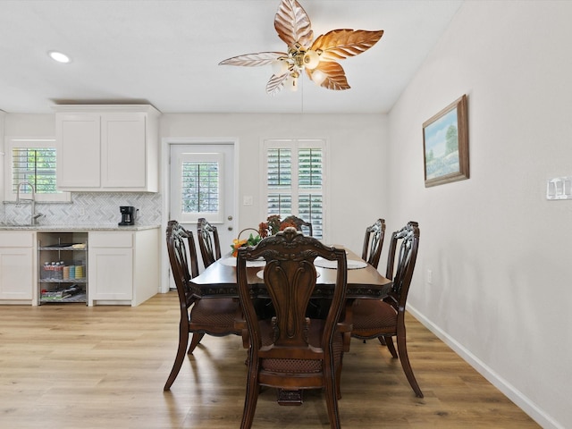 dining room featuring light wood-type flooring, ceiling fan, baseboards, and recessed lighting