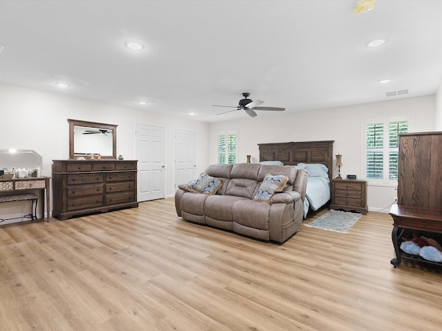 bedroom with ceiling fan, recessed lighting, visible vents, baseboards, and light wood-type flooring