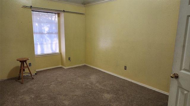 spare room with dark carpet