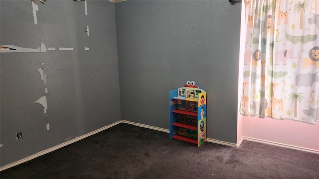 playroom featuring carpet flooring and baseboards