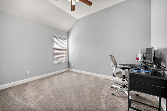 carpeted home office with a ceiling fan, vaulted ceiling, and baseboards