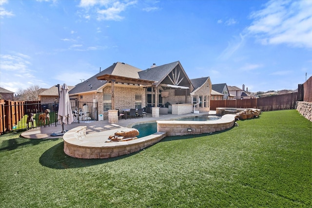 rear view of property with a fenced backyard, an in ground hot tub, brick siding, a lawn, and a fenced in pool