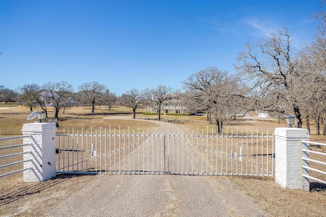 view of gate with fence