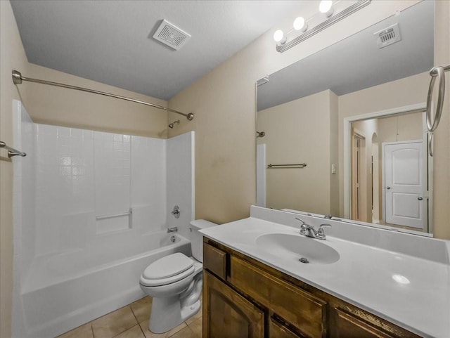 bathroom featuring visible vents, toilet, tile patterned flooring, vanity, and washtub / shower combination