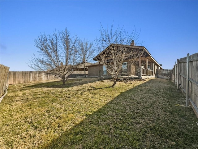 view of yard featuring a fenced backyard