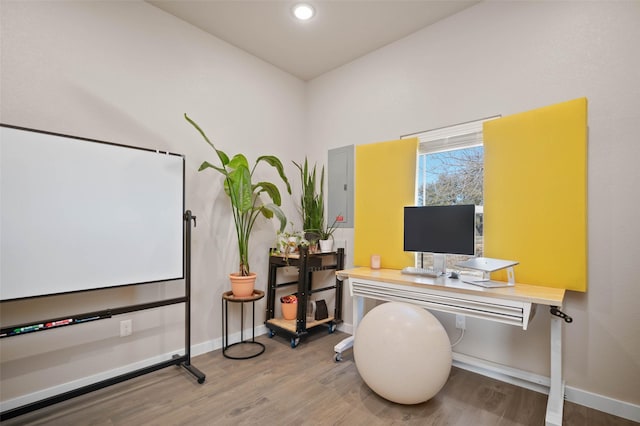 office space featuring recessed lighting, baseboards, and wood finished floors