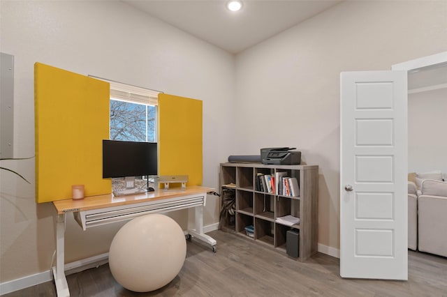 home office featuring recessed lighting, wood finished floors, and baseboards