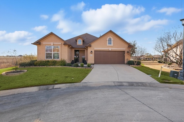 view of front of house featuring driveway, a garage, a front lawn, and stucco siding