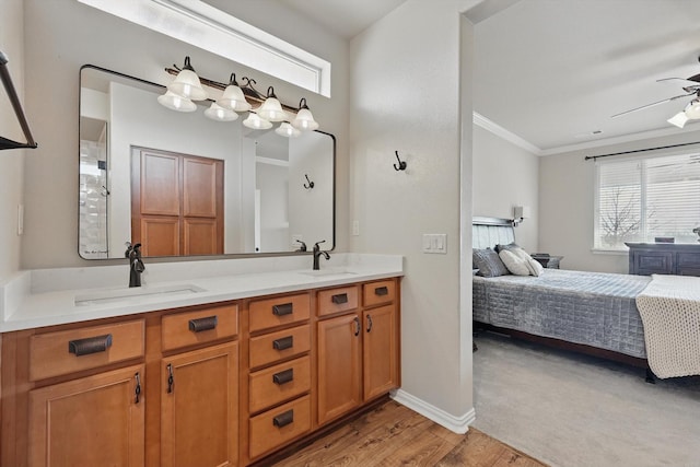 10112 Parkcrest Ct, Denton, TX 76207 - full bathroom featuring ensuite bathroom, a sink, crown molding, and wood finished floors