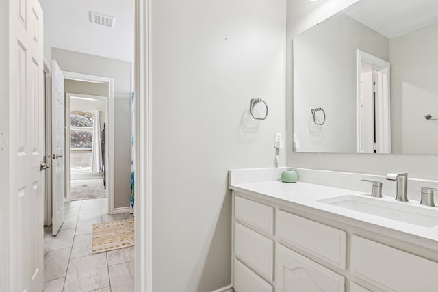 5505 Lomita Cir, Plano, TX 75023 - bathroom featuring marble finish flooring, vanity, and baseboards