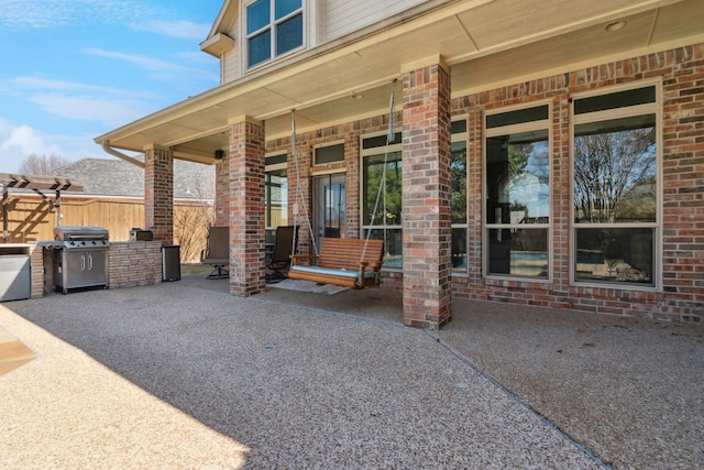 5505 Lomita Cir, Plano, TX 75023 - view of patio featuring a grill, a porch, and fence