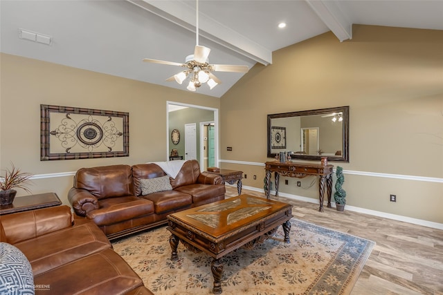 living area featuring vaulted ceiling with beams, visible vents, light wood-style flooring, a ceiling fan, and baseboards