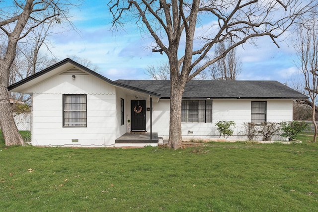 ranch-style house featuring a front lawn, crawl space, and a shingled roof