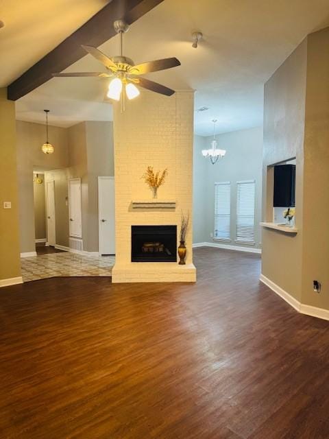 unfurnished living room featuring dark wood-style floors, a fireplace, baseboards, and ceiling fan