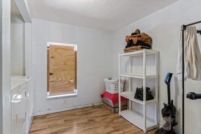 storage area with washing machine and clothes dryer