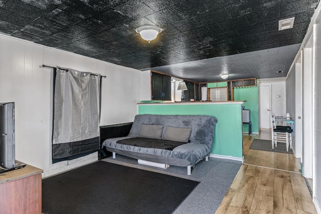 interior space featuring visible vents and wood finished floors