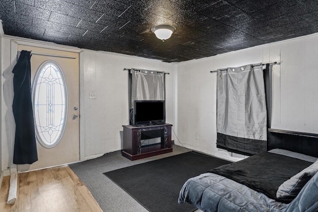 interior space featuring an ornate ceiling and wood finished floors