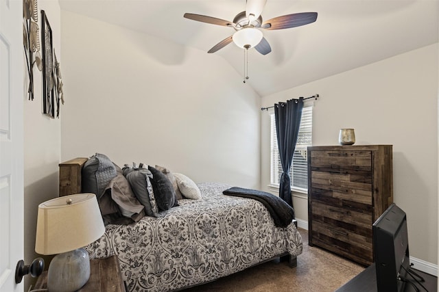 bedroom with lofted ceiling, carpet floors, a ceiling fan, and baseboards