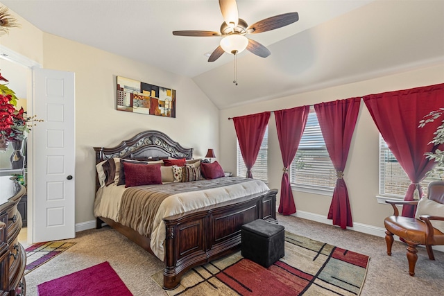 bedroom featuring vaulted ceiling, light carpet, a ceiling fan, and baseboards