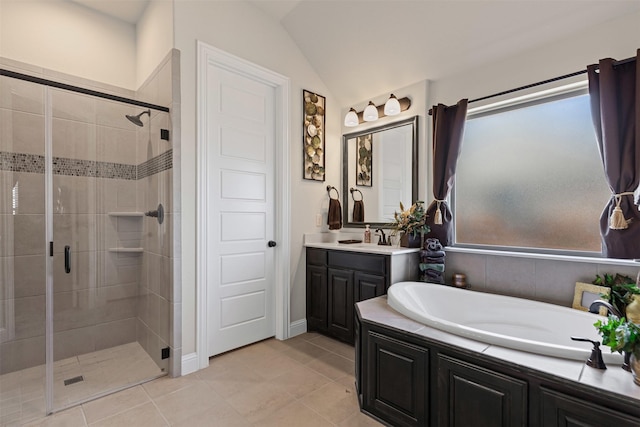 full bath with a stall shower, vanity, a bath, and tile patterned floors