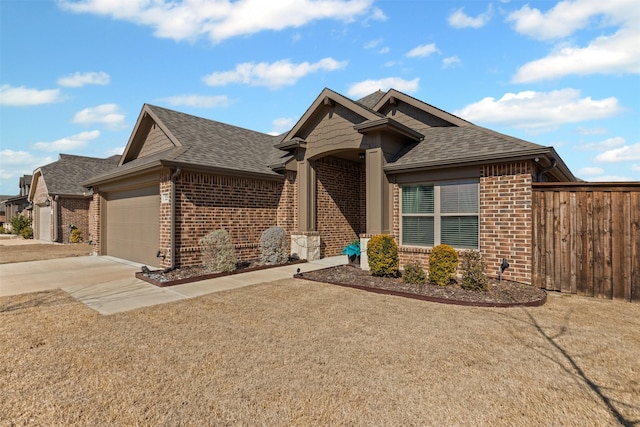 ranch-style home with driveway, a shingled roof, an attached garage, and brick siding