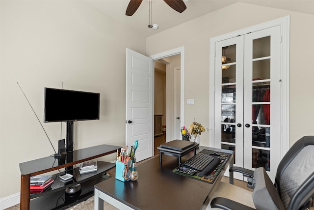 office featuring vaulted ceiling, french doors, and a ceiling fan