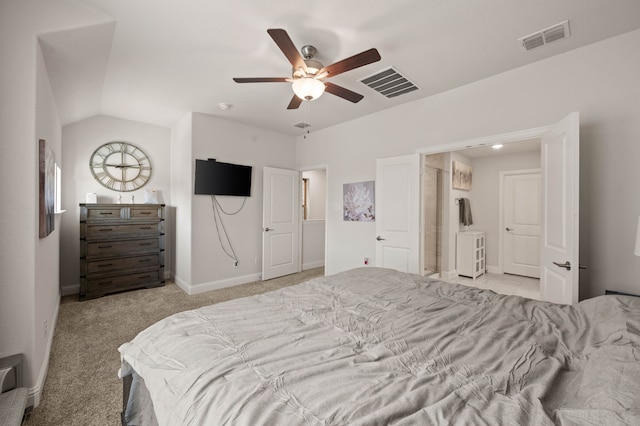 bedroom featuring light carpet, baseboards, visible vents, and lofted ceiling