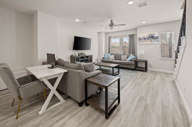 living room featuring recessed lighting, visible vents, a ceiling fan, light wood-type flooring, and baseboards