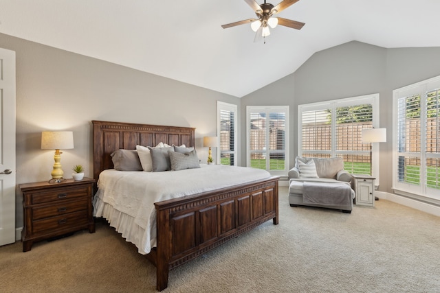 bedroom with a ceiling fan, lofted ceiling, and light colored carpet