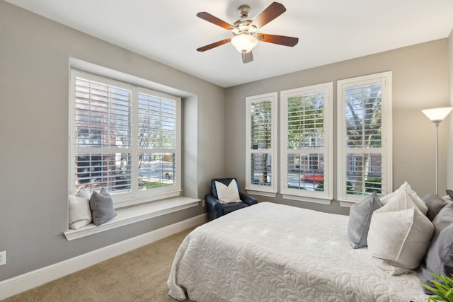 bedroom featuring carpet, ceiling fan, and baseboards