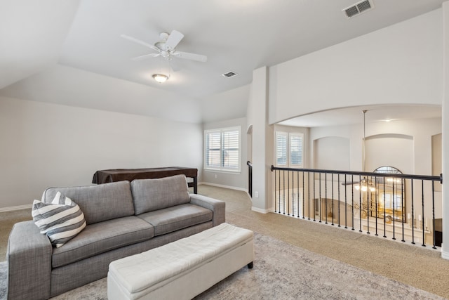 living room featuring carpet, visible vents, and baseboards