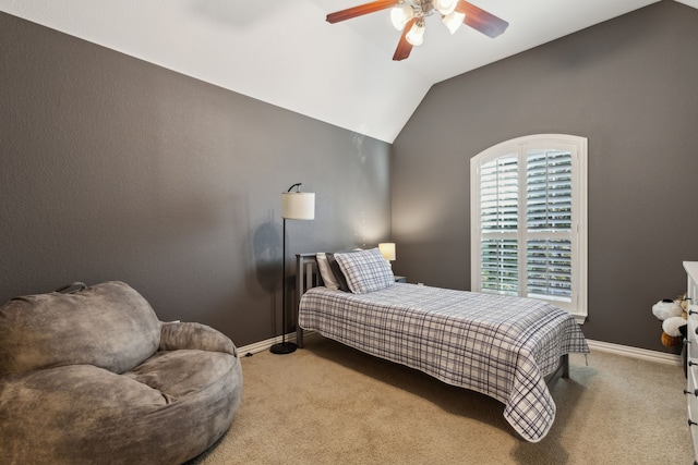 bedroom featuring lofted ceiling, ceiling fan, baseboards, and carpet flooring