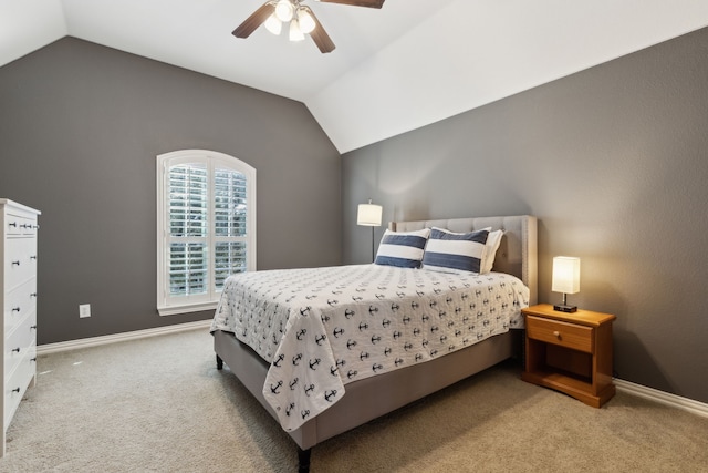 bedroom featuring carpet floors, baseboards, vaulted ceiling, and a ceiling fan