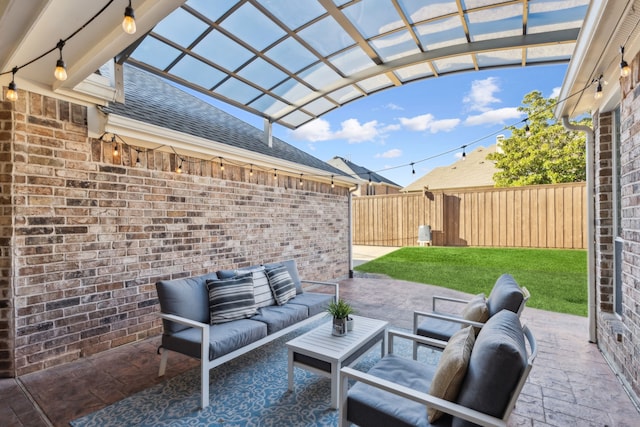 view of patio / terrace with an outdoor hangout area and fence