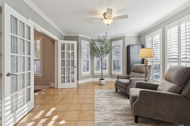 sitting room with baseboards, a ceiling fan, ornamental molding, french doors, and light tile patterned flooring