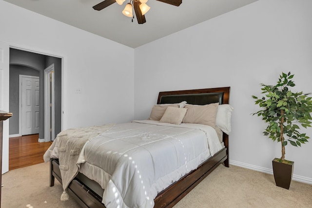 bedroom featuring carpet floors, a ceiling fan, and baseboards