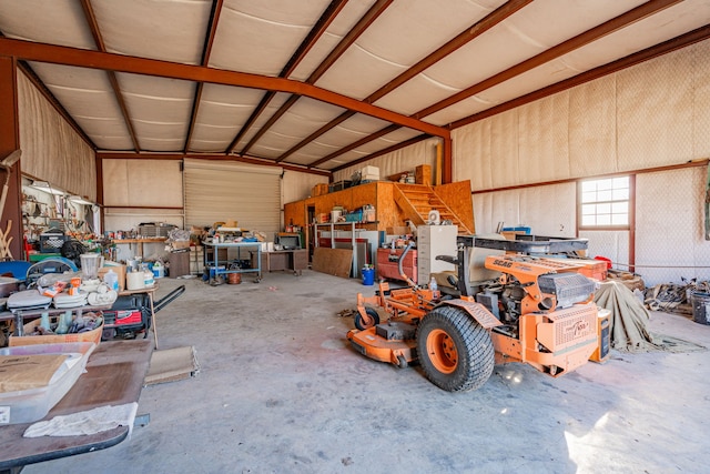 garage featuring a workshop area and metal wall