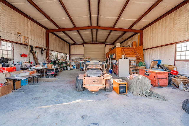 garage with metal wall and a workshop area