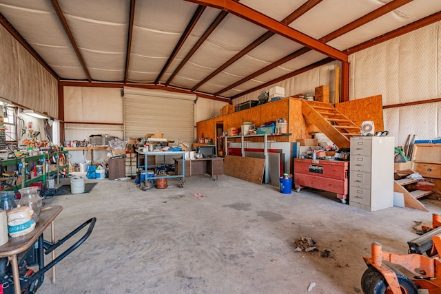 garage with metal wall and a workshop area