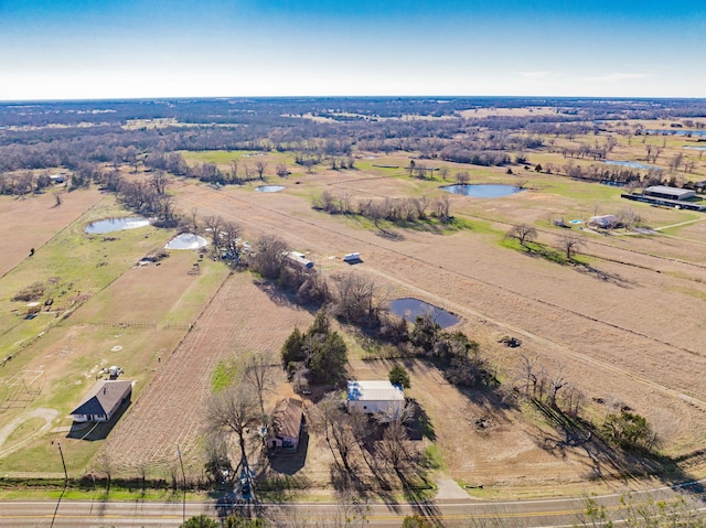 birds eye view of property with a rural view and a water view